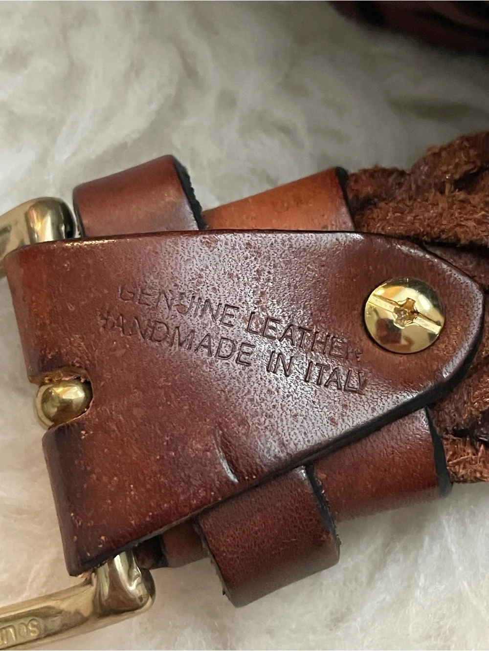 Brown braided leather belt with gold tone buckle. Made in Italy 52” length
